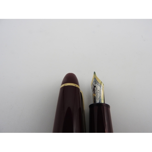 445 - A MONT BLANC MEISTERSTUCK FOUNTAIN PEN, dark red coloured body, the nib marked '4810 MB 14k MONT BLA... 