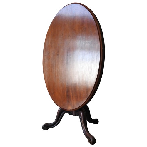 50 - A 19TH CENTURY MAHOGANY LOO TABLE, tilting oval top on a turned baluster base on three down swept sc... 
