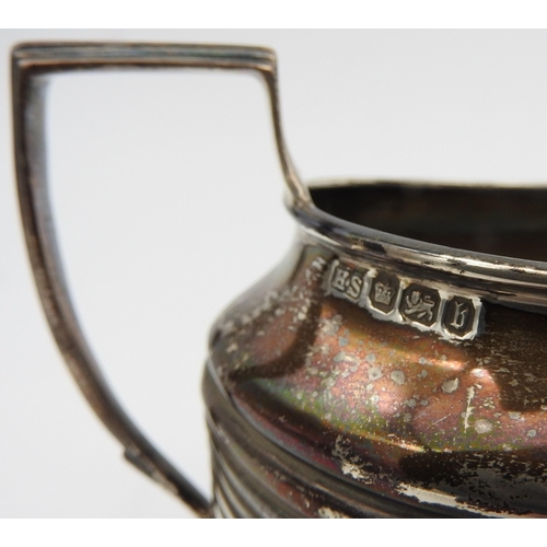 485 - A SILVER MILK JUG AND A MATCHING SUGAR BOWL, both with fluted and ribbed decoration, bears the mark ... 