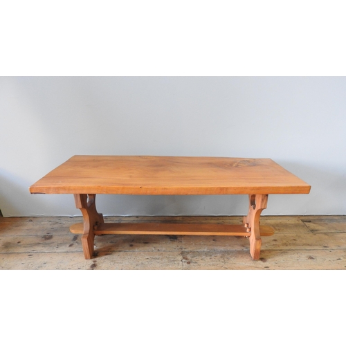 68 - A 20TH CENTURY ELM COFFEE TABLE, in a refectory style with two trefoil carved end panels united by a... 