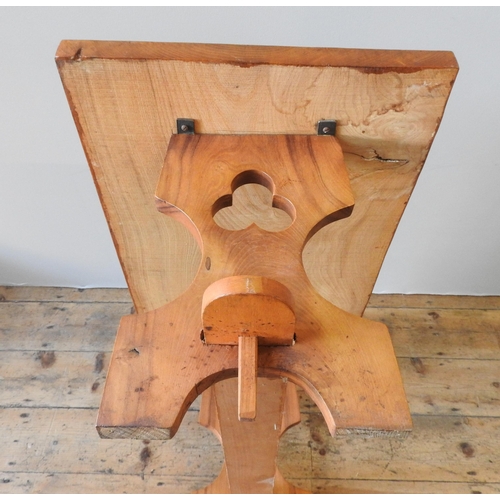 68 - A 20TH CENTURY ELM COFFEE TABLE, in a refectory style with two trefoil carved end panels united by a... 