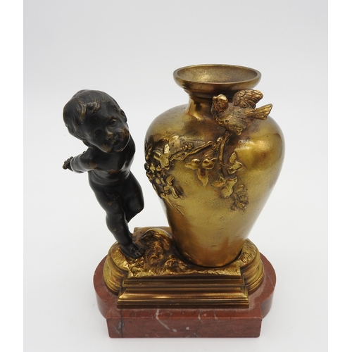 321 - A 19TH CENTURY GILT AND PATINATED BRONZE SCULPTURE, depicting a putto holding flowering blossom behi... 