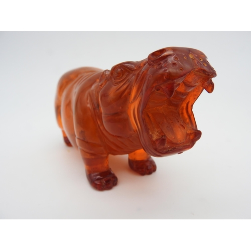 318 - A CARVED FIGURE OF HIPPOPOTAMUS, 6 x 12.5 cm