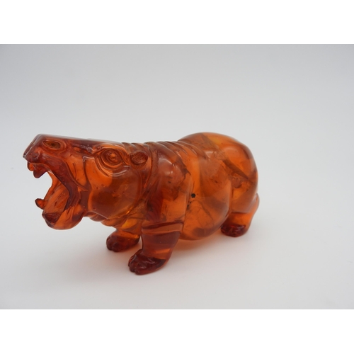 318 - A CARVED FIGURE OF HIPPOPOTAMUS, 6 x 12.5 cm