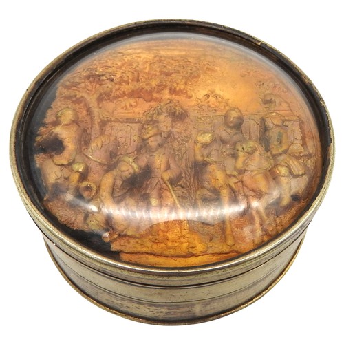 431 - A 19TH CENTURY CIRCULAR WHITE METAL SNUFF POT, the glazed lid inset with a gilt metal relief panel d... 