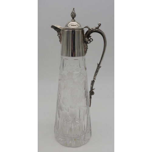 527 - AN ELEGANT SILVER MOUNTED CUT GLASS CLARET JUG, of tapered form with etched vine decoration to the b... 