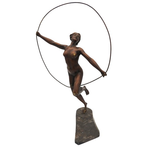 322 - AN ART DECO CAST BRONZE FIGURINE OF NUDE, in gymnastic pose with hoop, on a tapering marble plinth b... 