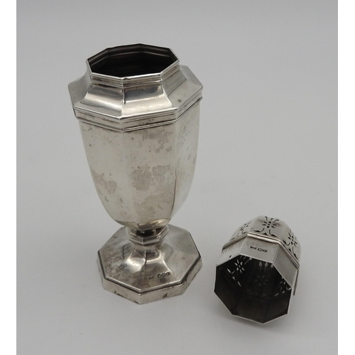 511 - A SILVER SUGAR SIFTER, octagonal baluster form with floral pierced lid surmounted by finial, raised ... 