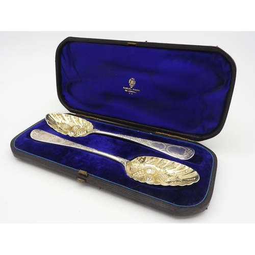 505 - A PAIR OF 18TH CENTURY SILVER BERRY SPOONS, with bright cut decorated handles, rubbed indistinct hal... 