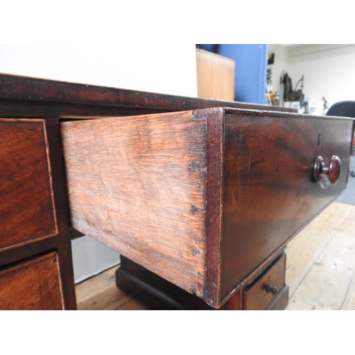 69 - A 19TH CENTURY MAHOGANY WRITING DESK, with leather inset top, a long frieze drawer flanked by two ba... 