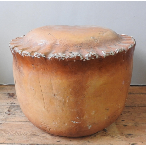 302 - AN OVERSIZED PORK PIE THEATRICAL PROP, constructed from canvas covered polystyrene, 60 cm high x 80 ... 