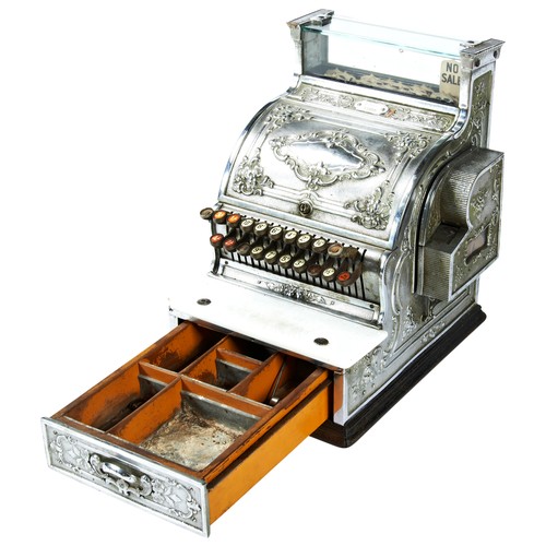 307 - A CHROMIUM PLATED NATIONAL CASH REGISTER, the case with decorative raised decoration, late 19th cent... 