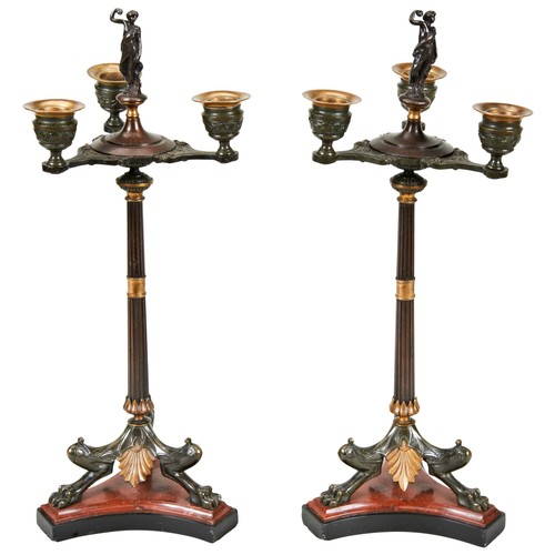 598 - A PAIR OF BRONZE AND MARBLE EMPIRE CANDELABRACIRCA 1820-30the reeded columns surmounted by three out... 