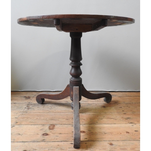 8 - A 19TH CENTURY OAK TRIPOD TABLE, circa 1850, the circular top raised on a turned baluster pillar, su... 