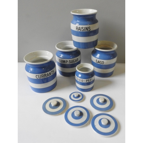 246 - FOUR CORNISHWARE STORAGE JARS BY GREEN & CO LTD, blue and white banded, 16 cm high, along with a... 