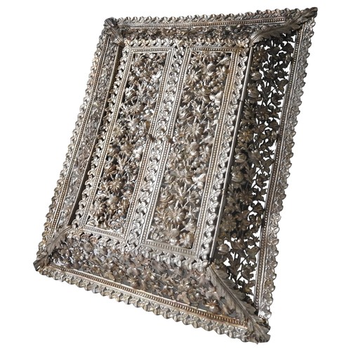 526 - INDIAN SILVER PICTURE FRAMEEARLY 20TH CENTURYof cushion-form, the sides ornately pierced with scroll... 