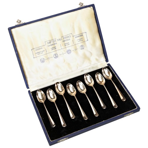 477 - A SET OF EIGHT SILVER 'RAT TAIL' TEASPOONS,  in presentation case, bears the mark of Roberts & B... 