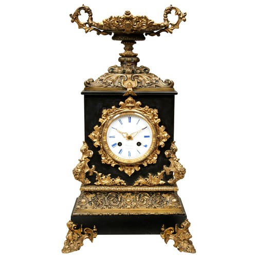 179 - A FRENCH BRONZE AND BLACK SLATE MANTEL CLOCK, circa 1860, striking movement by Japy Freres with silk... 