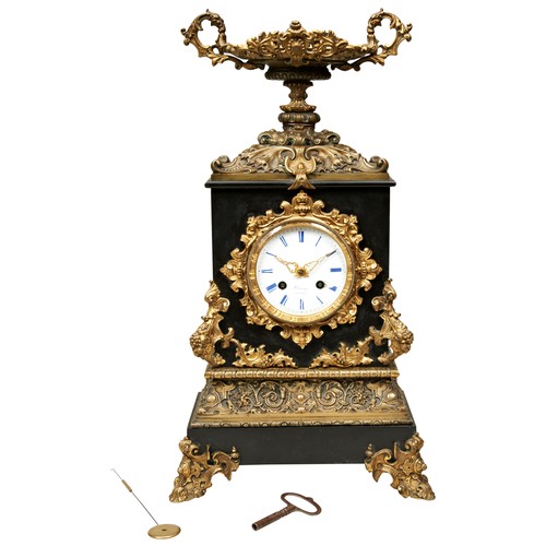 179 - A FRENCH BRONZE AND BLACK SLATE MANTEL CLOCK, circa 1860, striking movement by Japy Freres with silk... 