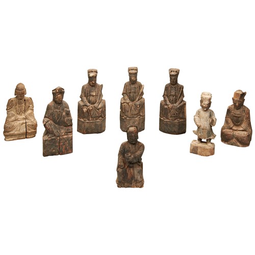 228 - A GROUP OF EIGHT CHINESE CARVED WOOD FIGURESMING / QING DYNASTYsome traces of old polychrome painted... 