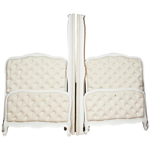 86 - A PAIR OF FRENCH SINGLE BED STEADS, 20th century, cream painted frames with carved floral decoration... 