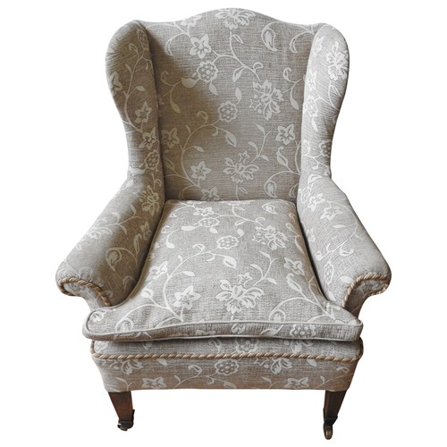 54 - A 19TH CENTURY WING BACK ARMCHAIR, recovered in bold floral damask material, raised on tapered squar... 