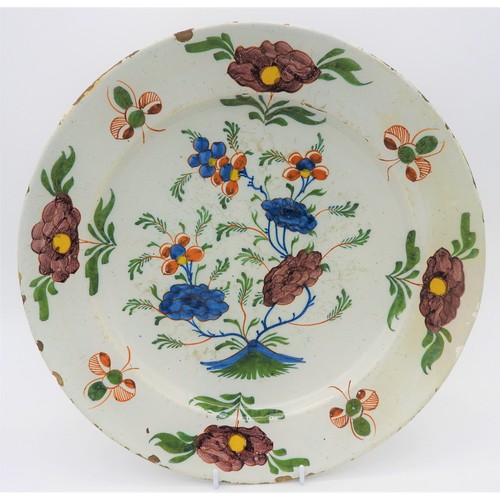 251 - DUTCH DELFT POLYCHROME CHARGER 18TH CENTURYdecorated with blossoming flowers in a rocky outcrop, 35c... 