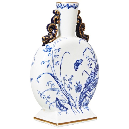 202A - A CHINESE STYLE BLUE AND WHITE MOONFLASK, prunus and butterfly decoration, surmounted by two Chilong... 