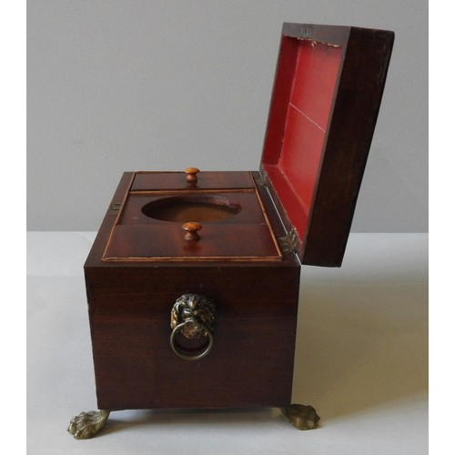 430A - A REGENCY MAHOGANY TEA CADDY, on gilt metal claw feet with lion decorated brass ring handles to the ... 