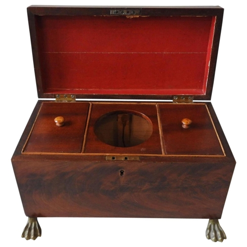 430A - A REGENCY MAHOGANY TEA CADDY, on gilt metal claw feet with lion decorated brass ring handles to the ... 