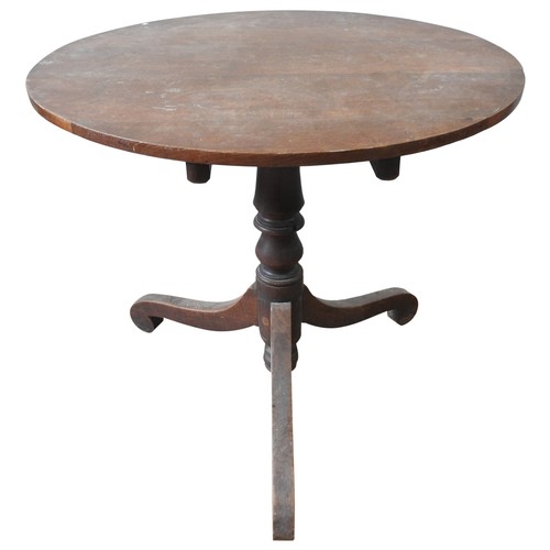 8 - A 19TH CENTURY OAK TRIPOD TABLE, circa 1850, the circular top raised on a turned baluster pillar, su... 