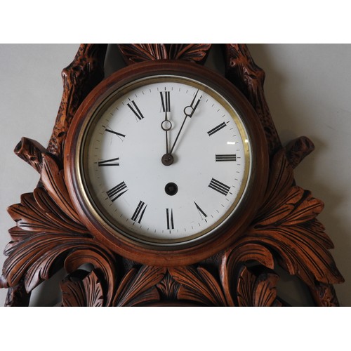 120 - A 19TH CENTURY WALL MOUNTED CLOCK / BAROMETER, in an unusual lozenge shaped mahogany case, ornately ... 