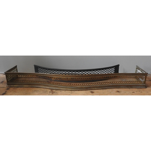 77 - A 19TH CENTURY PIERCED BRASS FENDER AND A CURVED CAST-IRON FENDER, with pierced lattice designBrass ... 