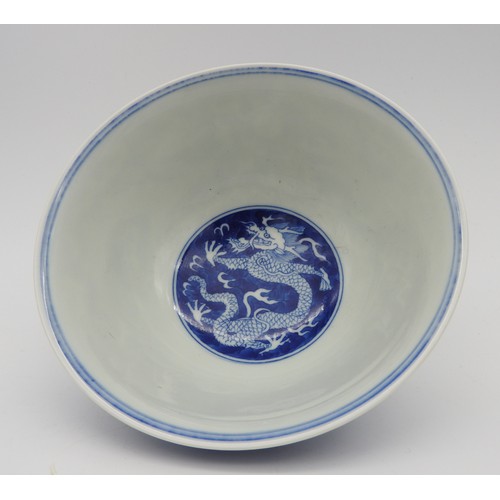 245 - A CHINESE BLUE & WHITE 'DRAGON' BOWL., 20th century, with apocryphal Kangxi six character, 16.5 ... 