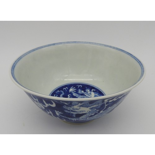 245 - A CHINESE BLUE & WHITE 'DRAGON' BOWL., 20th century, with apocryphal Kangxi six character, 16.5 ... 