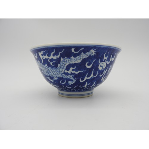 245 - A CHINESE BLUE & WHITE 'DRAGON' BOWL., 20th century, with apocryphal Kangxi six character, 16.5 ... 