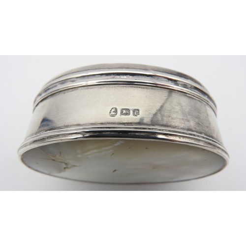 425 - A LATE 19TH CENTURY SILVER AND MOTHER OF PEARL BOX, oval form, the hinged cover inset with carved mo... 