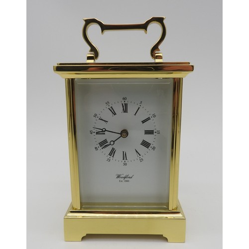 122 - A BRASS CARRIAGE TIMEPIECE