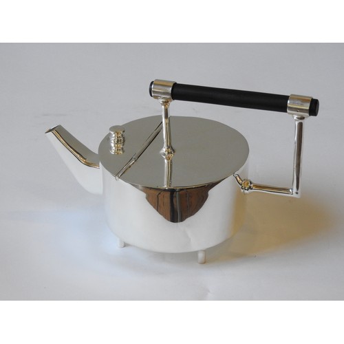 420 - AN ELECTRO PLATED JAPANESE STYLE TEAPOT, drum-shaped body with angular spout, raised on four cylindr... 