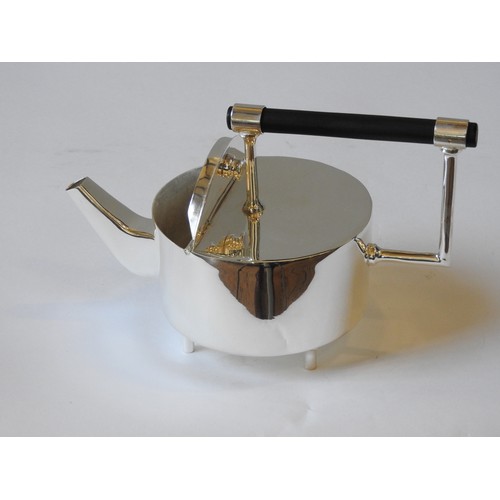 420 - AN ELECTRO PLATED JAPANESE STYLE TEAPOT, drum-shaped body with angular spout, raised on four cylindr... 