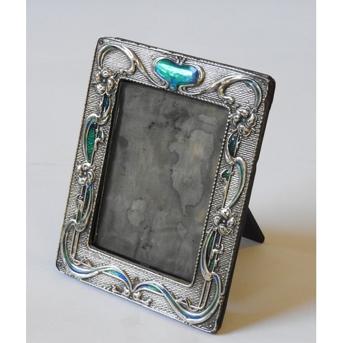 422 - A SILVER PICTURE FRAME, with enamelled Art Nouveau floral decoration19 x 15 cm