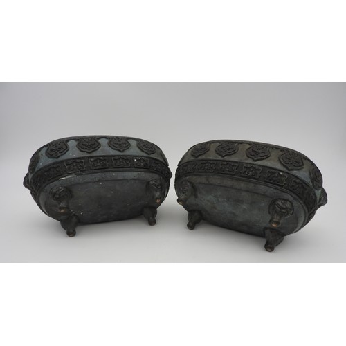 231 - A PAIR OF CHINESE BRONZE QUADRIPOD INCENSE BURNERS, elongated ovoid form, decorated with relief band... 