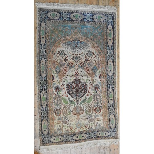 72 - A PERSIAN PART SILK RUG, decoration depicting birds and a archway, on a cream ground240 x 140 cm... 