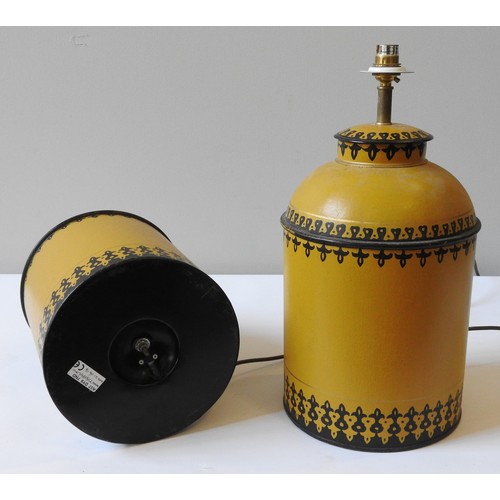 82 - PAIR OF OKA 'BERBER' TABLE LAMPS, cannister form, painted pale gold with border patterns, 45 cm high... 