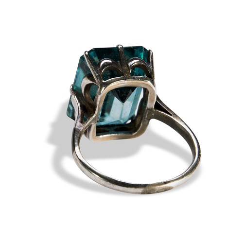 146 - A 20TH CENTURY BLUE ZIRCON RINGthe emerald-cut, cut cornered zircon eight claw to a pierced gallery,... 