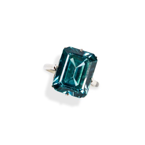 146 - A 20TH CENTURY BLUE ZIRCON RINGthe emerald-cut, cut cornered zircon eight claw to a pierced gallery,... 