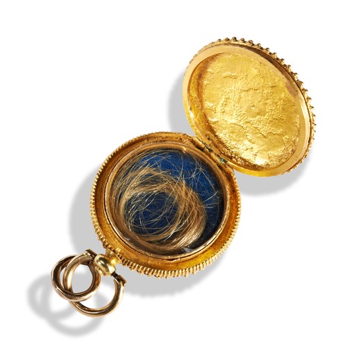 157 - A 19TH CENTURY TRICOLOUR GOLD ROUND LOCKET CIRCA 1840with applied gold flowers and leaves, hinged to... 