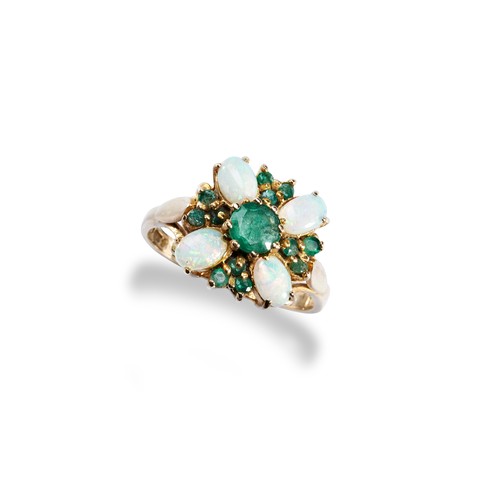 67 - A CONTEMPORARY OPAL AND EMERALD RINGthe central round cut, claw set, emerald surrounded by four oval... 