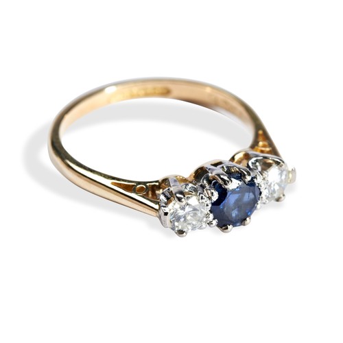 66 - A SAPPHIRE AND DIAMOND THREE STONE RINGthe central round cut, claw set, sapphire being flanked by tw... 