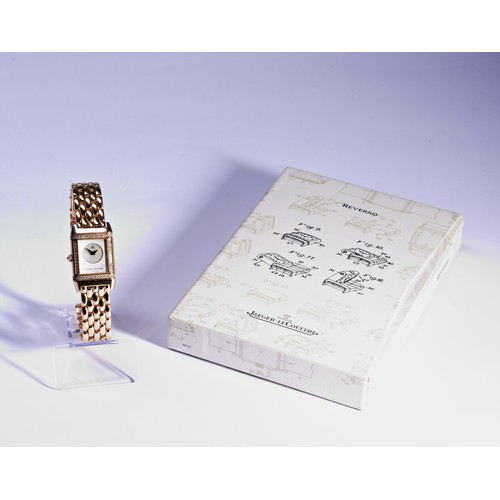 170 - JAEGER LE COULTRE: AN 18CT YELLOW GOLD AND DIAMOND SET LADIES DUETTO REVERSO WRISTWATCHref. 266.2.44... 